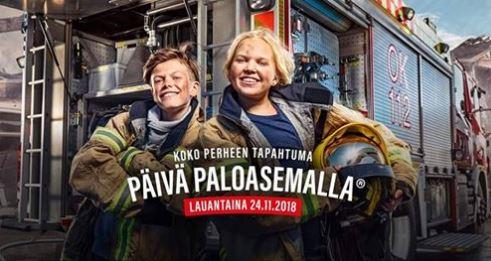 lapsi ja aikuinen palomiehen varusteissa