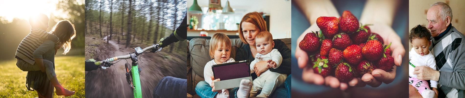 Lapsi kantaa toista reppuselässä, pyöräilijä maastossa, nainen katsomassa lasten kanssa tablettia, mansikoita käsissä, lapsi istuu vanhuksen sylissä.